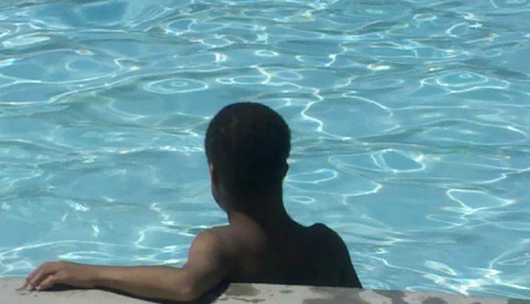A boy in a pool. 