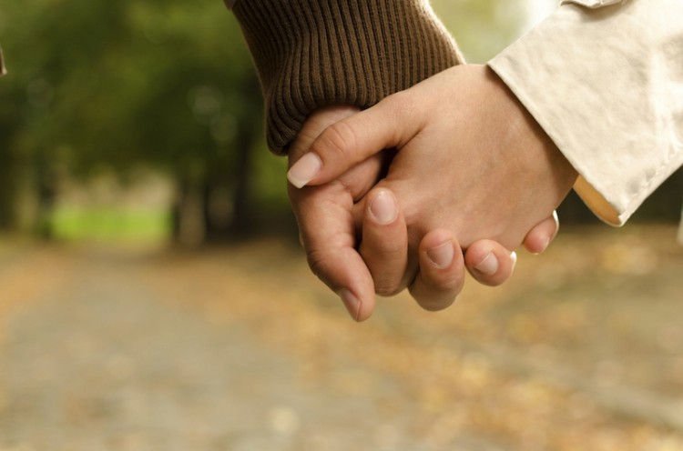 holding hands close up outdoors