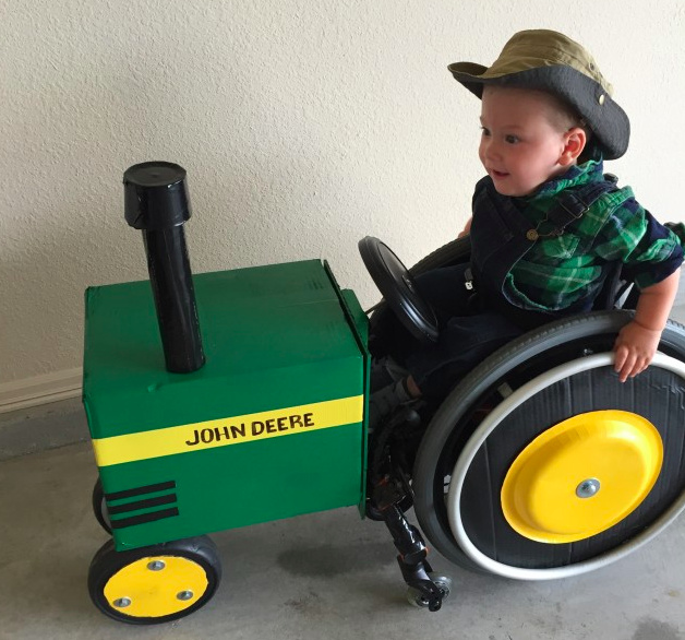 little boy on john deere tractor