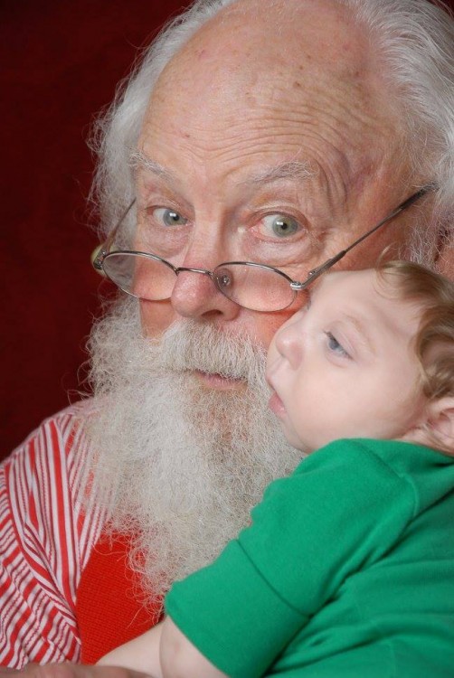 Santa looking at the camera with author's son
