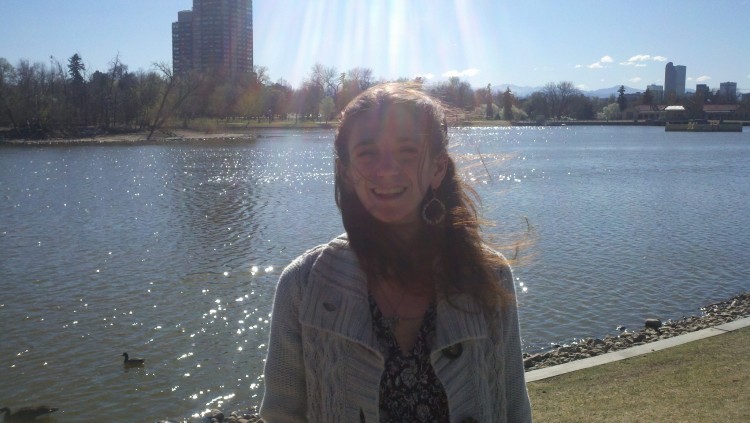 woman standing in front of a lake