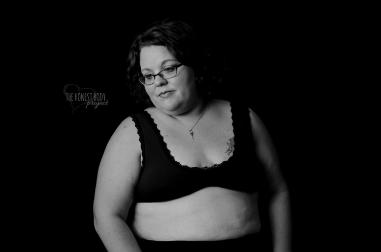 Somber woman poses in her underwear
