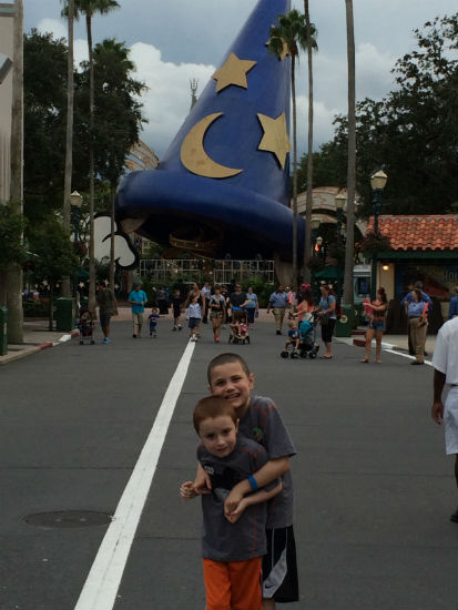 boys hugging at Disney World. 