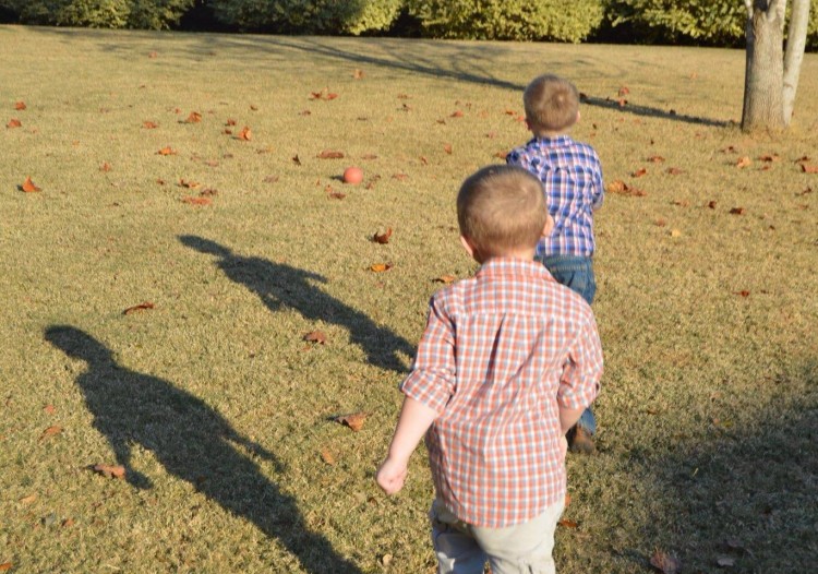 boys walking on grass