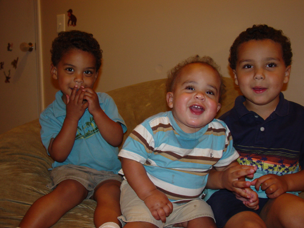 three young boys sitting together