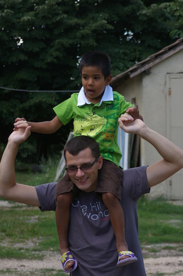 man holding boy on shoulders