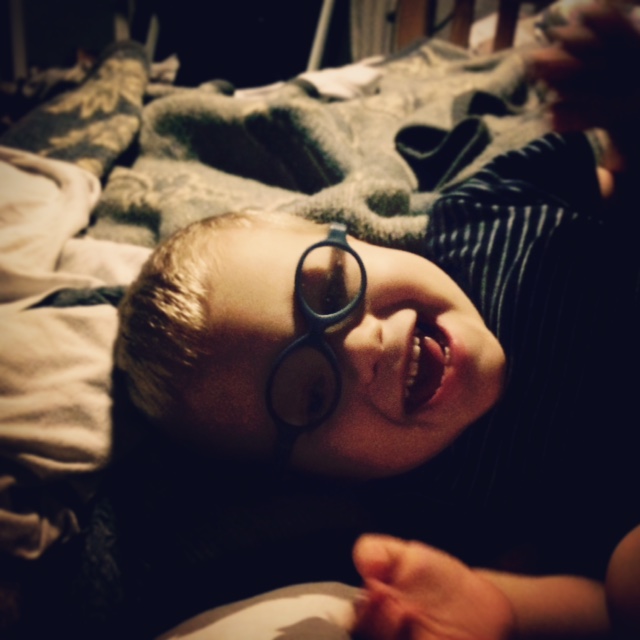 boy in glasses smiling