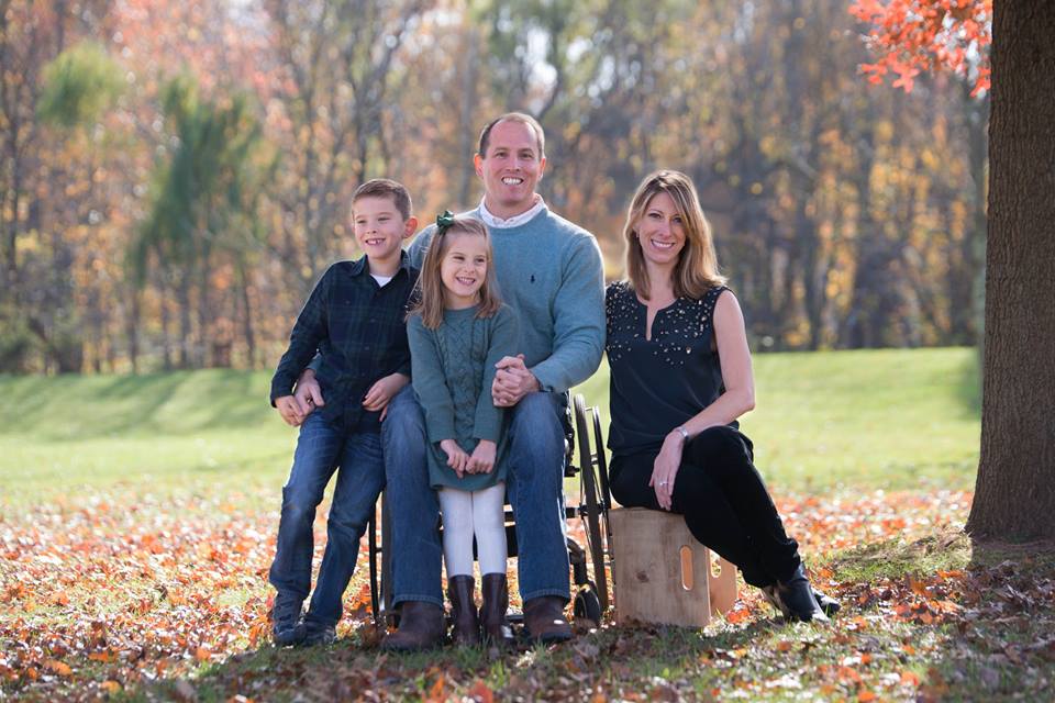 Family (husband, wife, son and daughter) in a park