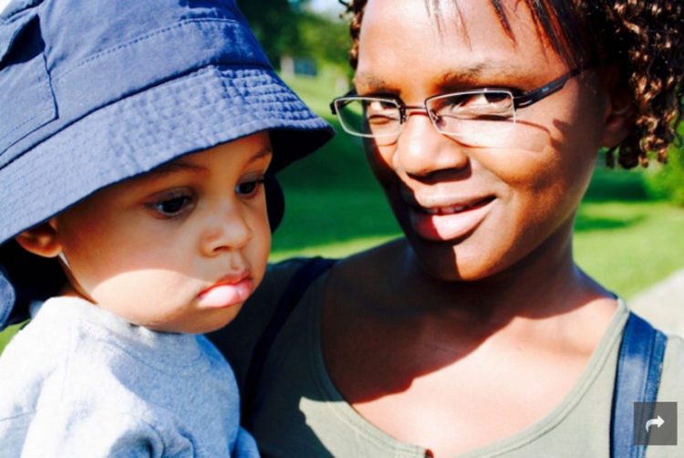 woman holding her son