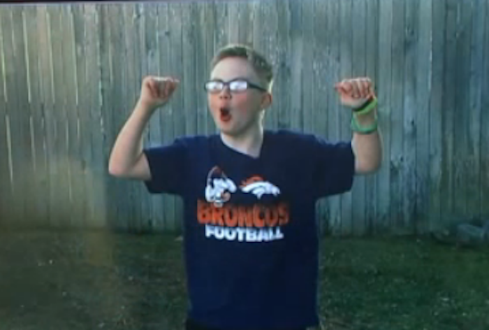 Boy with a Bronco's shirt on