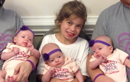 abby holding triplet babies