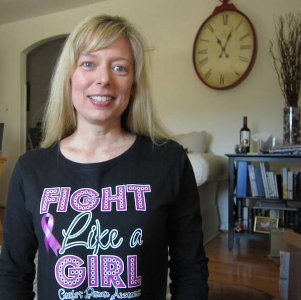 blonde woman wearing shirt that says fight like a girl