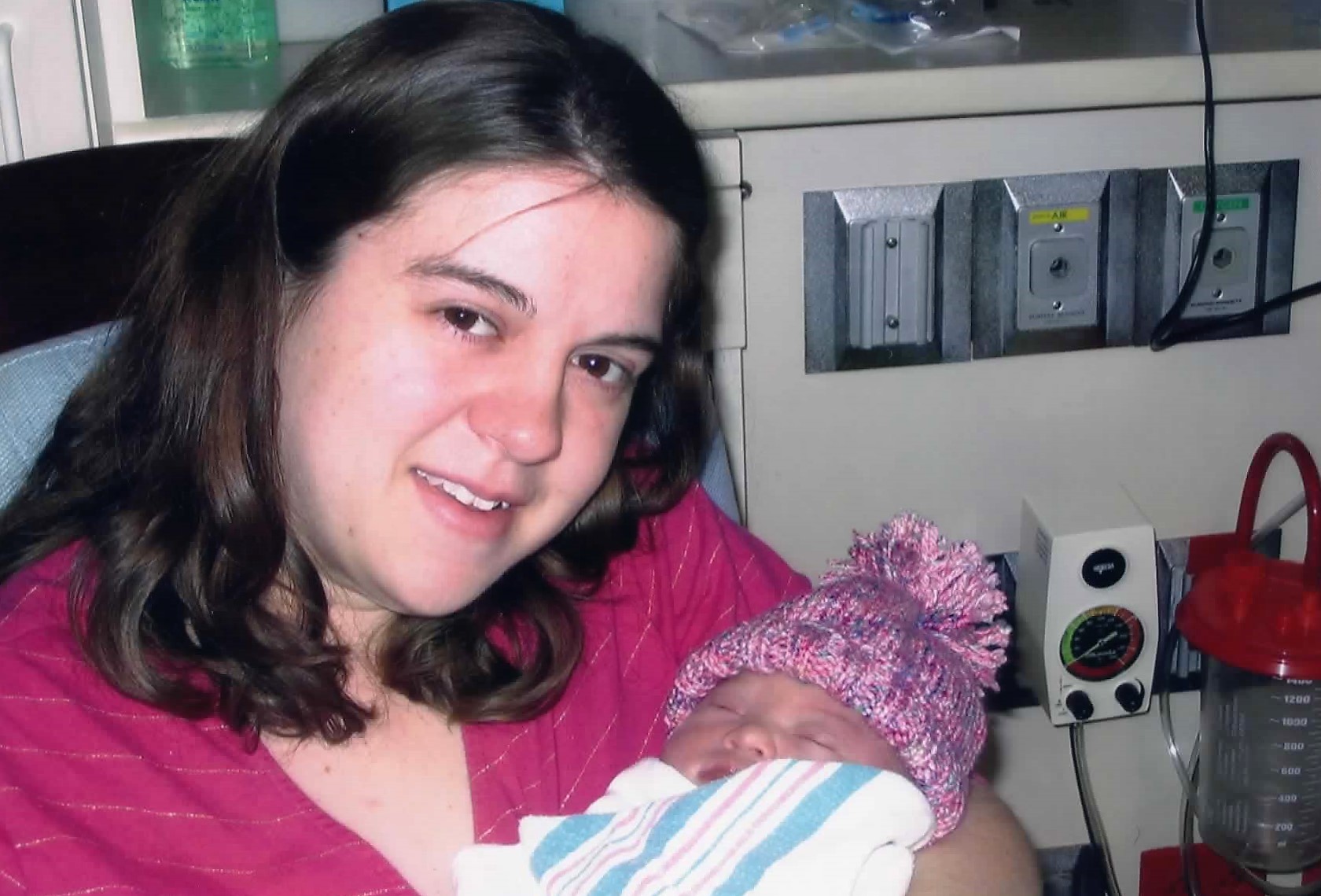 mother holding baby in hospital