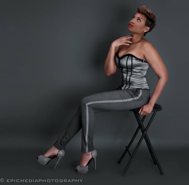 woman sitting on chair modeling an outfit