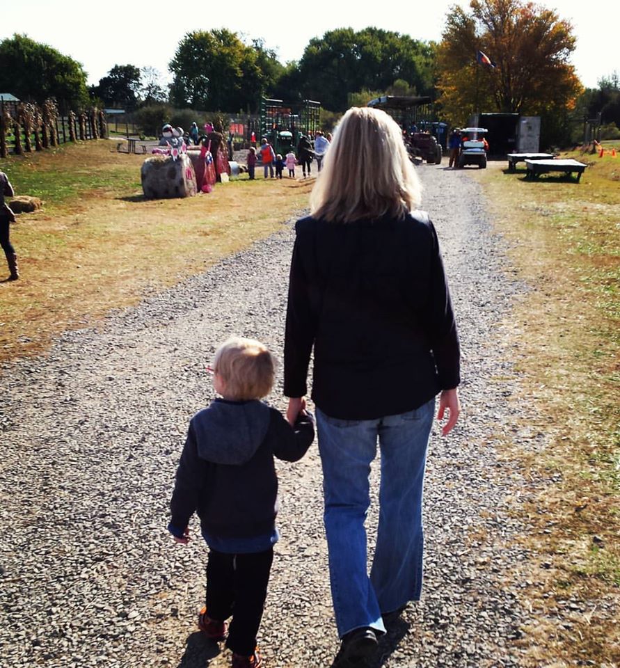 Mom and son walking at the zoo