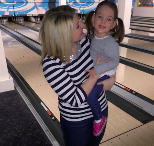 Mom and her daughter at a bowling alley