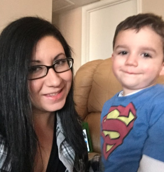 mom wearing glasses and young boy wearing superman shirt
