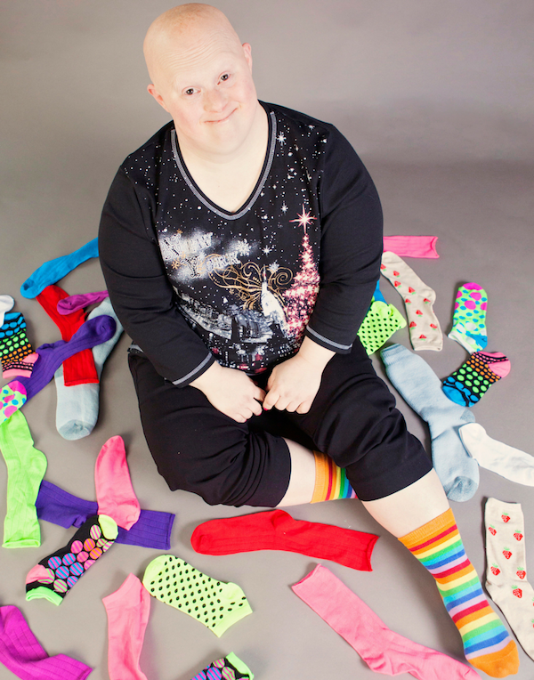 woman sitting in pile of socks