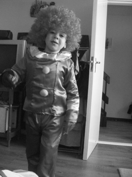 boy wearing costume and wig