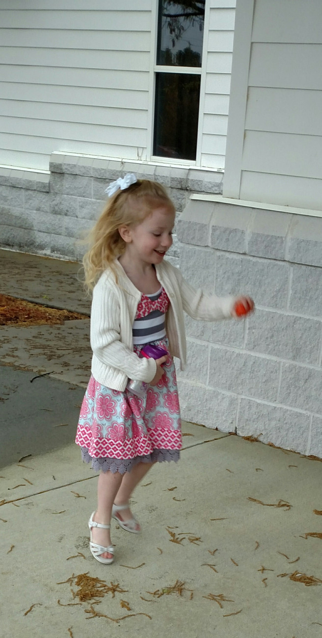piper playing with an easter egg