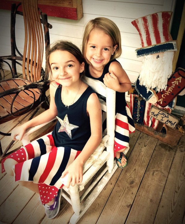 two girls searing red white and blue outfits