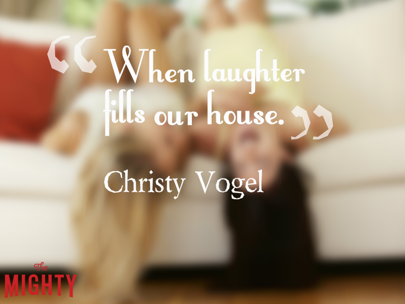 Two woman sitting on the couch upside down, laughing, with the text: “When laughter fills our house.”