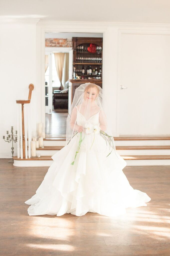 madeline stuart in wedding dress with veil over face