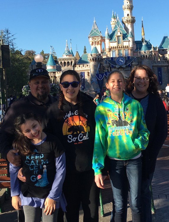 The Cota family -- mother, father, two daughters and their friend -- at Disneyland
