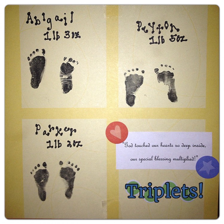 three inked footprints of a set of triplets