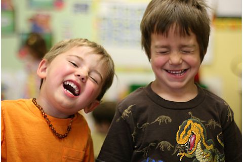 two young boys laughing together