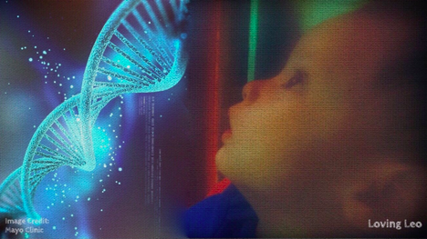 author's son leo looking at an image of DNA