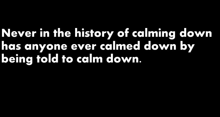 black meme with white writing about calming down