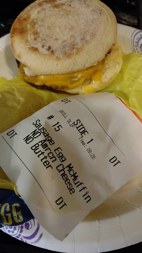 Photo of a Sausage Egg McMuffin next to a receipt