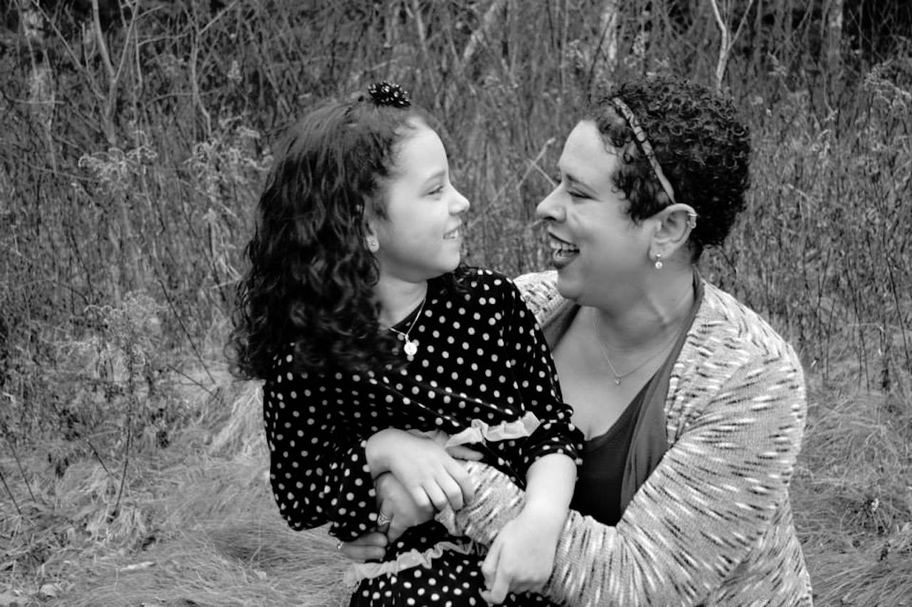 mom and daughter smiling