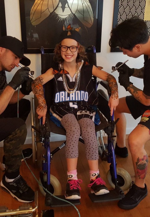 Girl in wheelchair gets tattooed