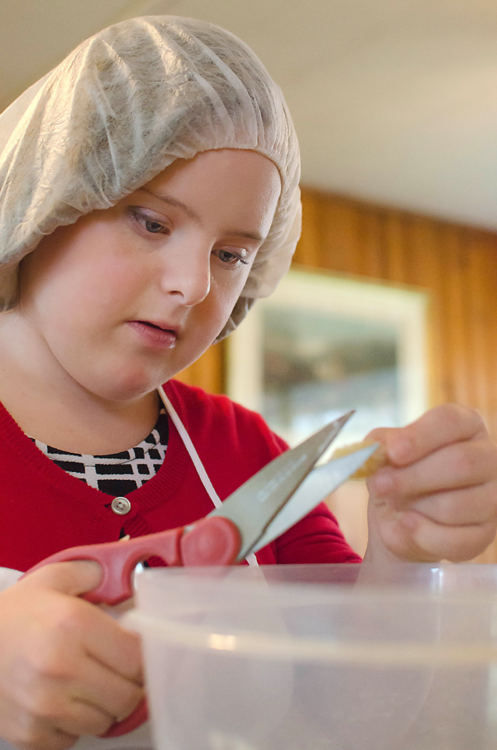 In a photo provided by Elise Sampson, Carolyn Sampson prepares Reason to Bake cookies.