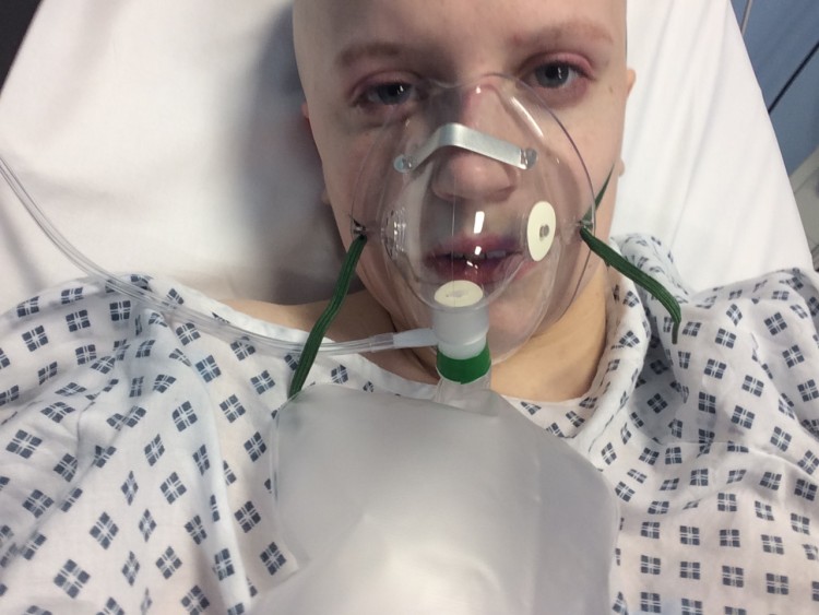 Natasha with an oxygen mask in hospital