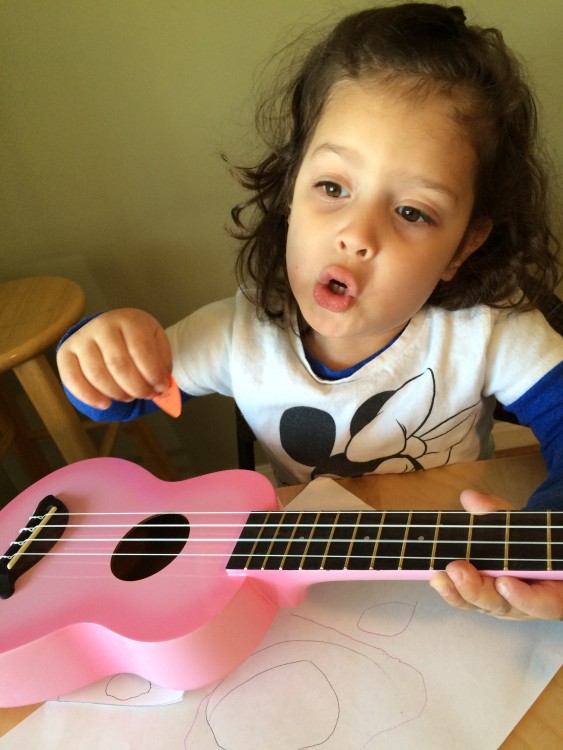 Lily playing ukulele.