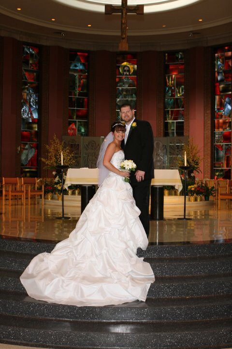bride and groom standing at altar