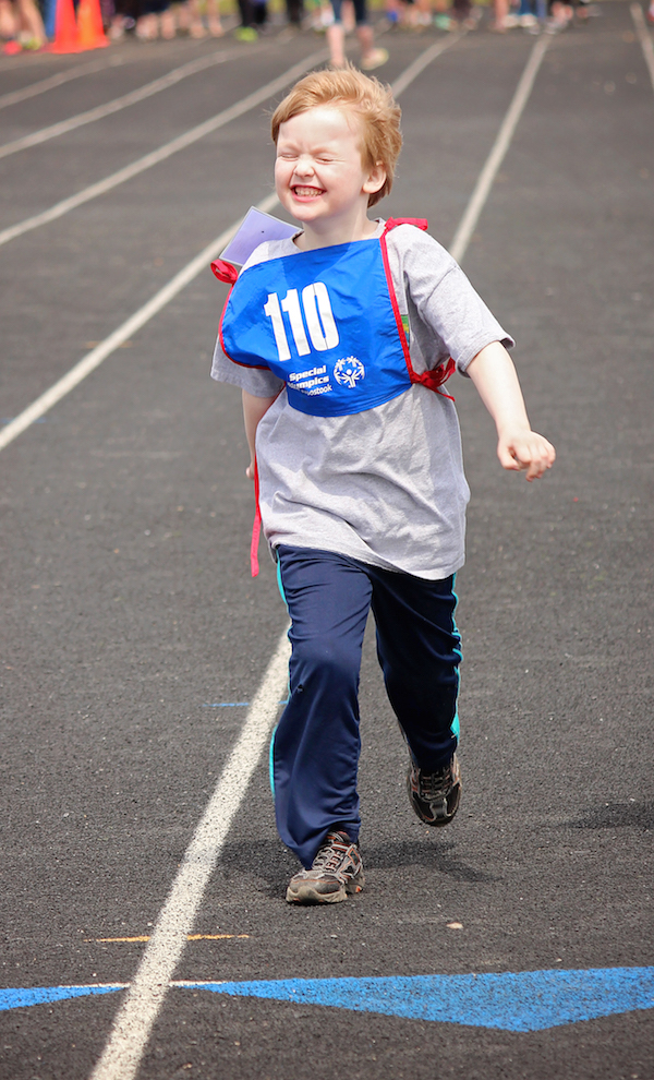 The author's son, walking on a track,