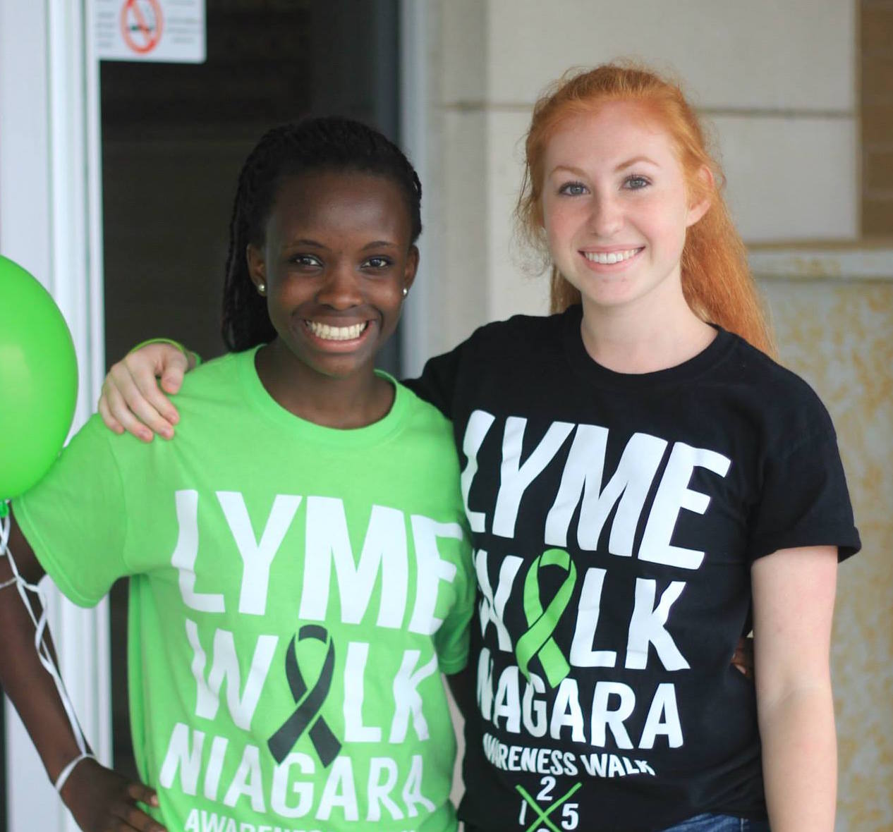 The author and her friend wearing Lyme Walk t-shirts