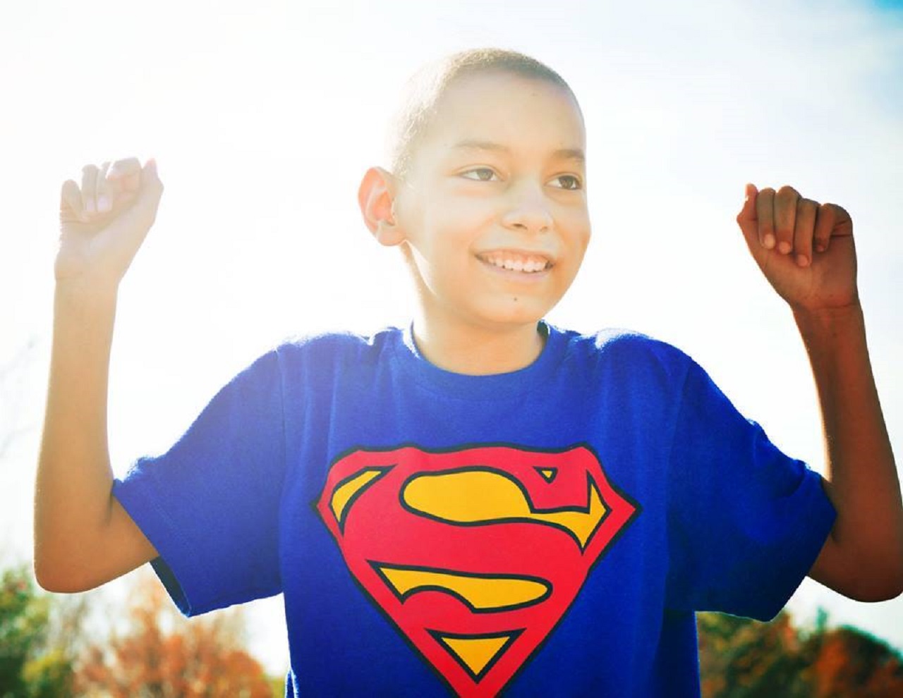 One of Stephanie Smith's photo subjects smiles in a Superman shirt.