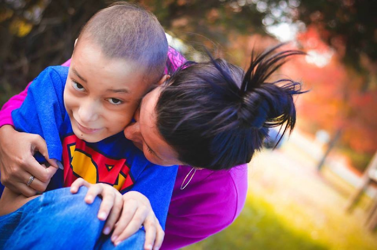 Stephanie Smith hugs one of her photo subjects.