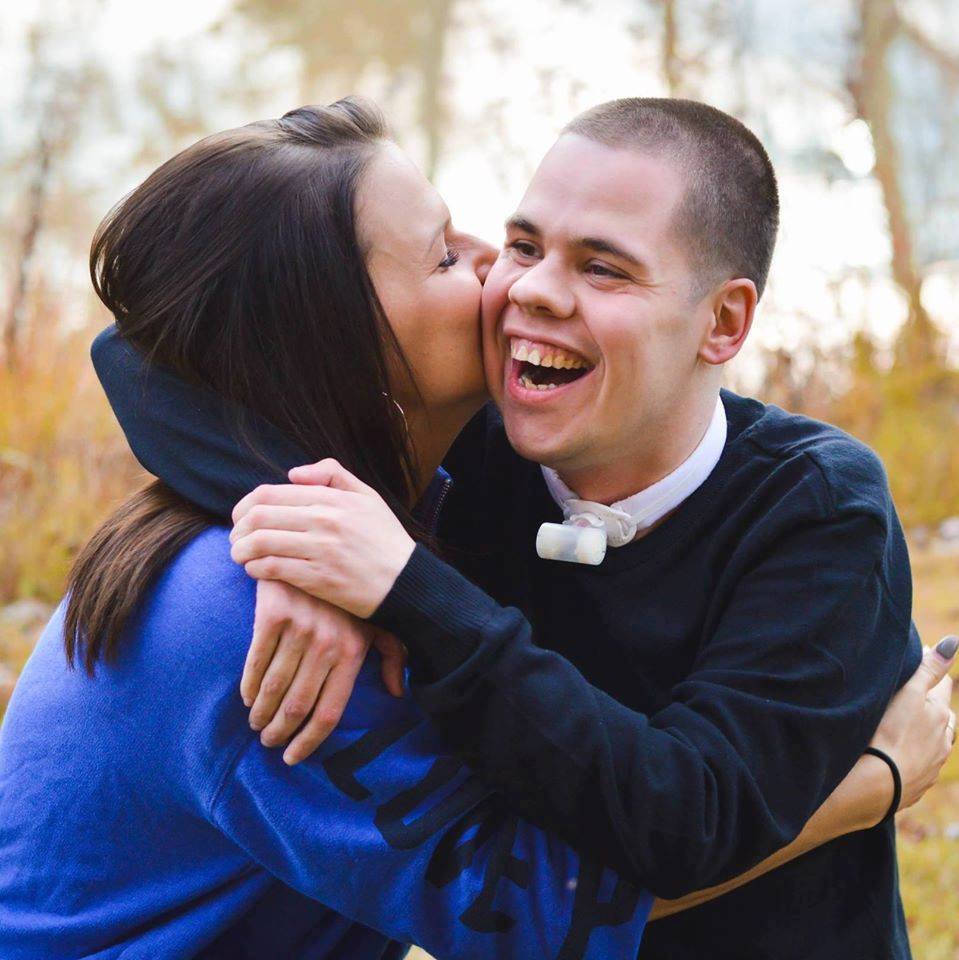 Stephanie Smith hugs one of her photo subjects.