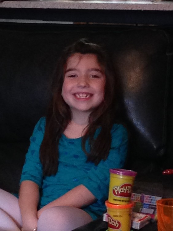 Cami's daughter smiling.