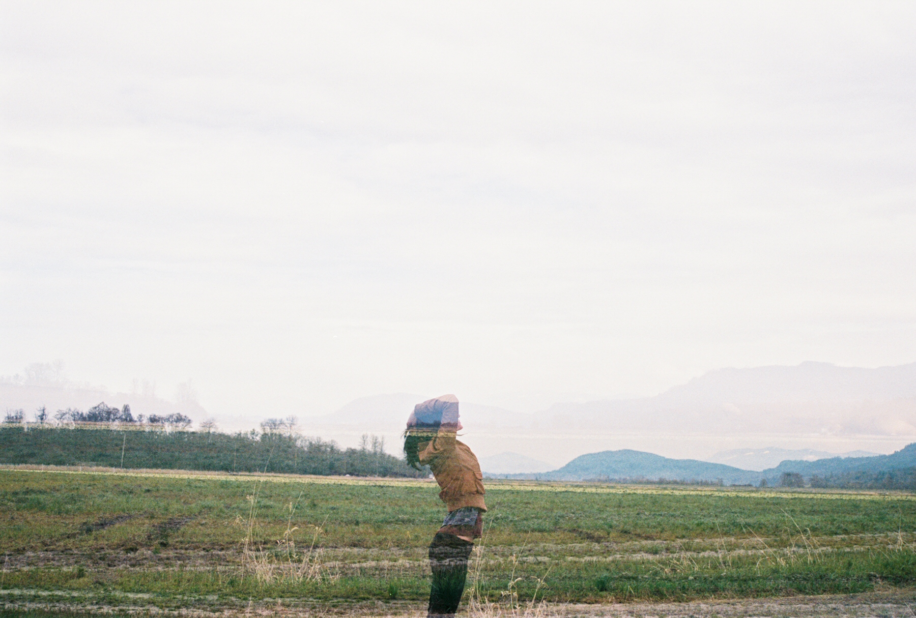woman standing in an empty field