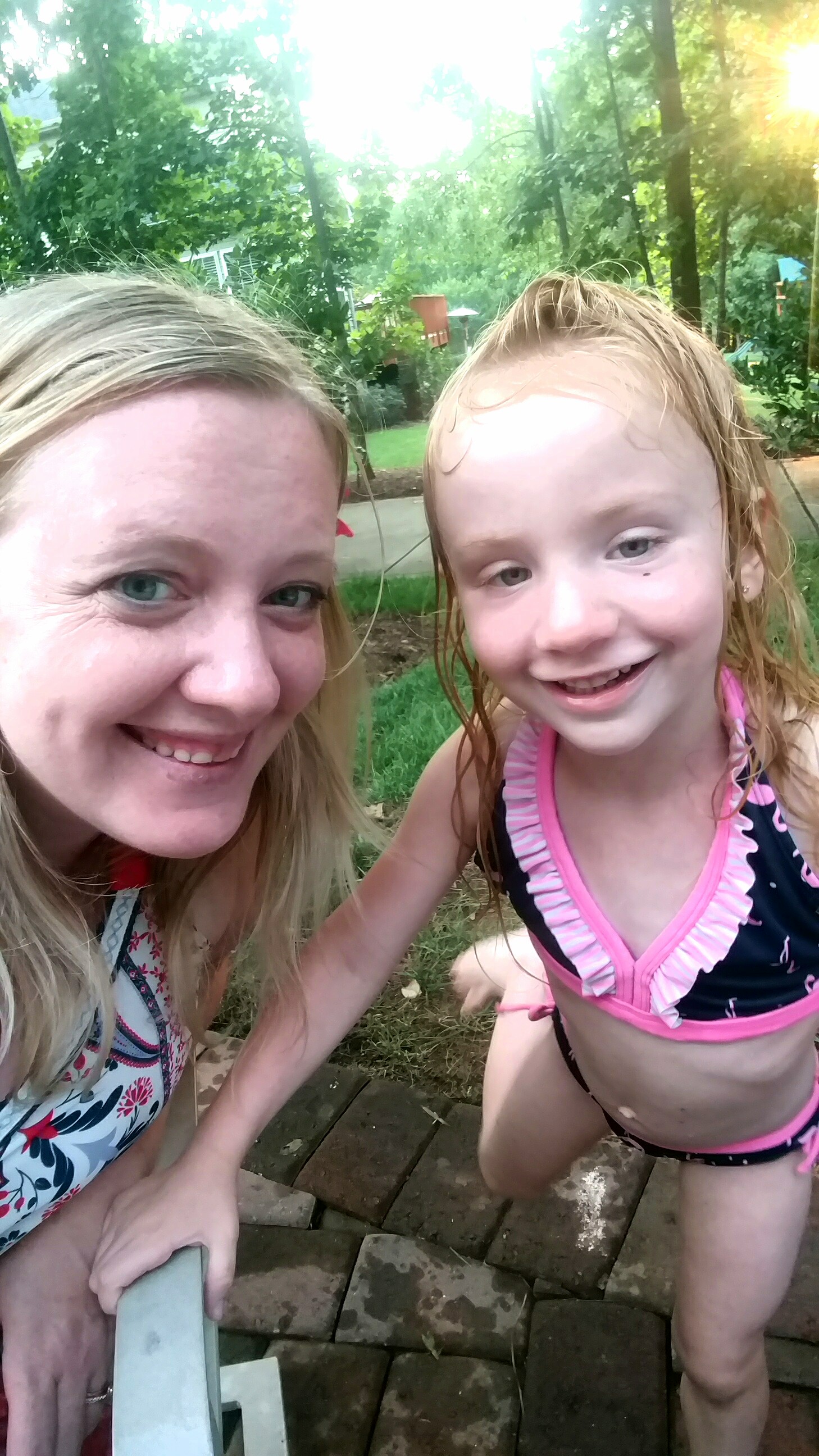 mom and little girl with autism at the pool