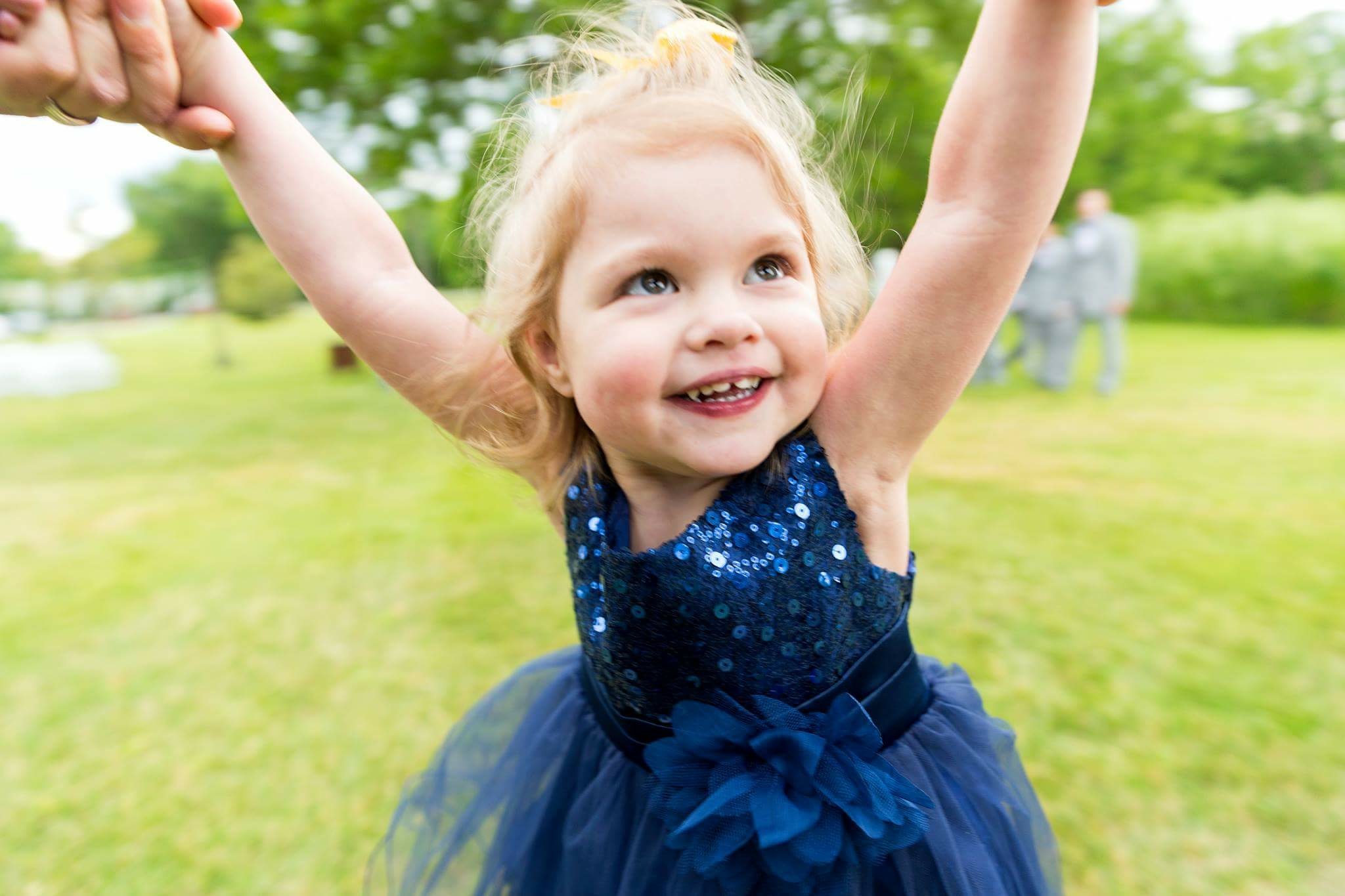 The author's daughter, playing on the grass