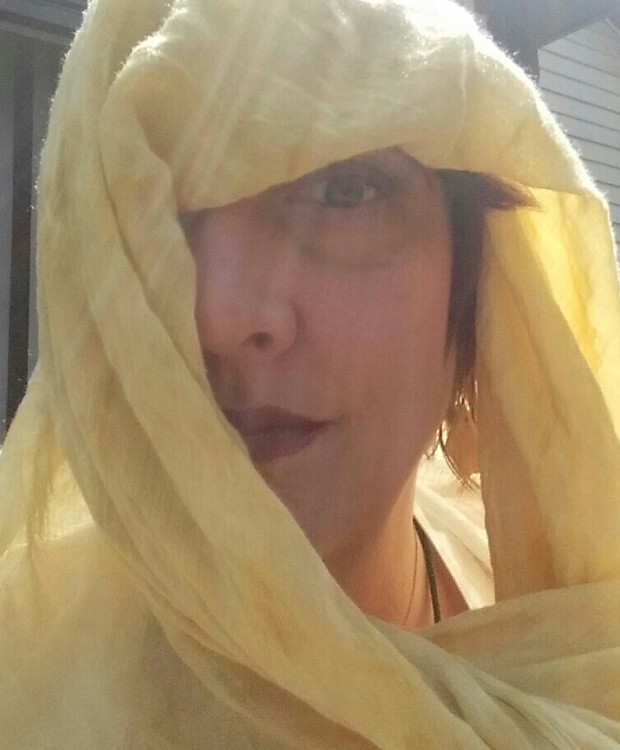 fabric shroud covering woman's head