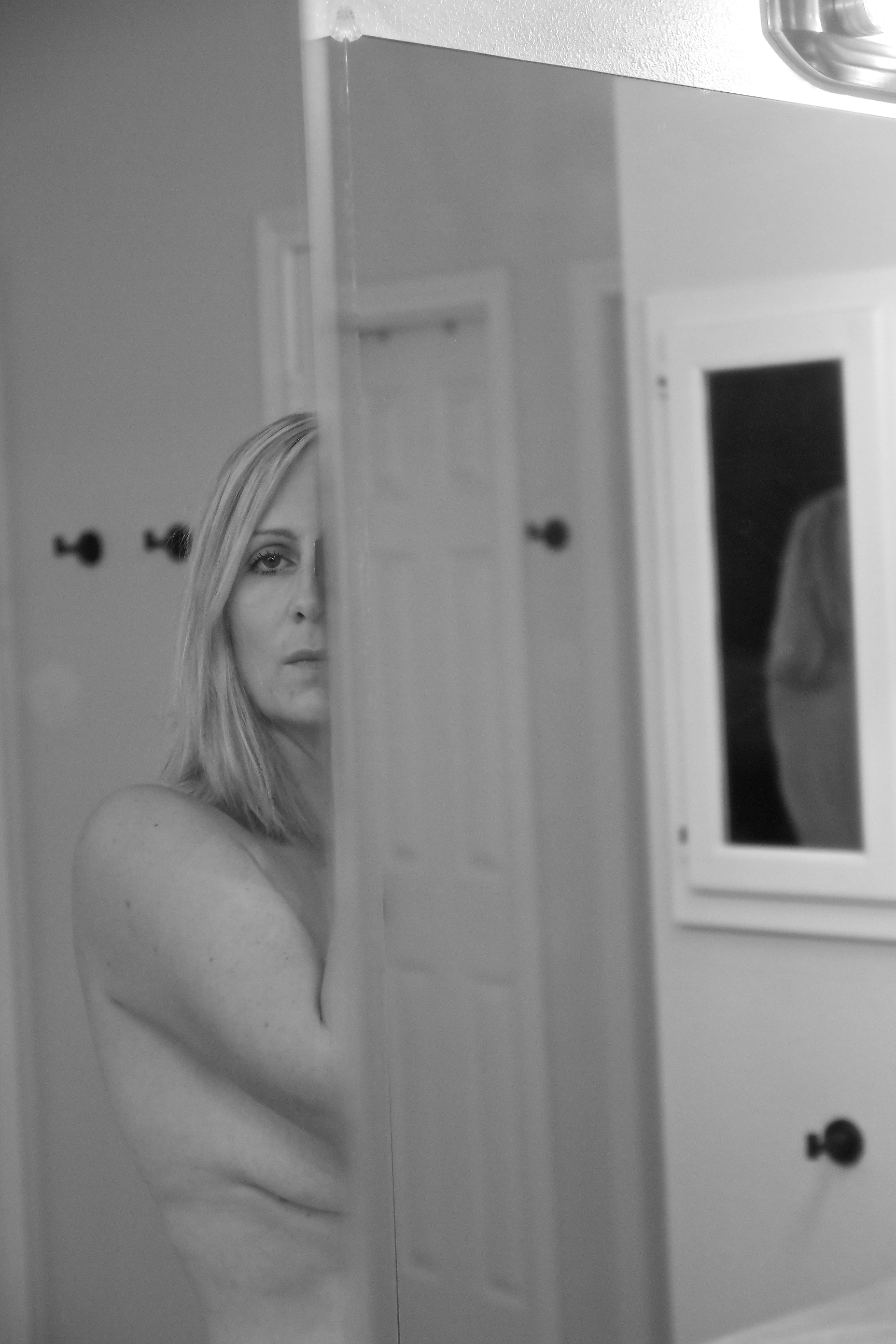 woman looking in the mirror